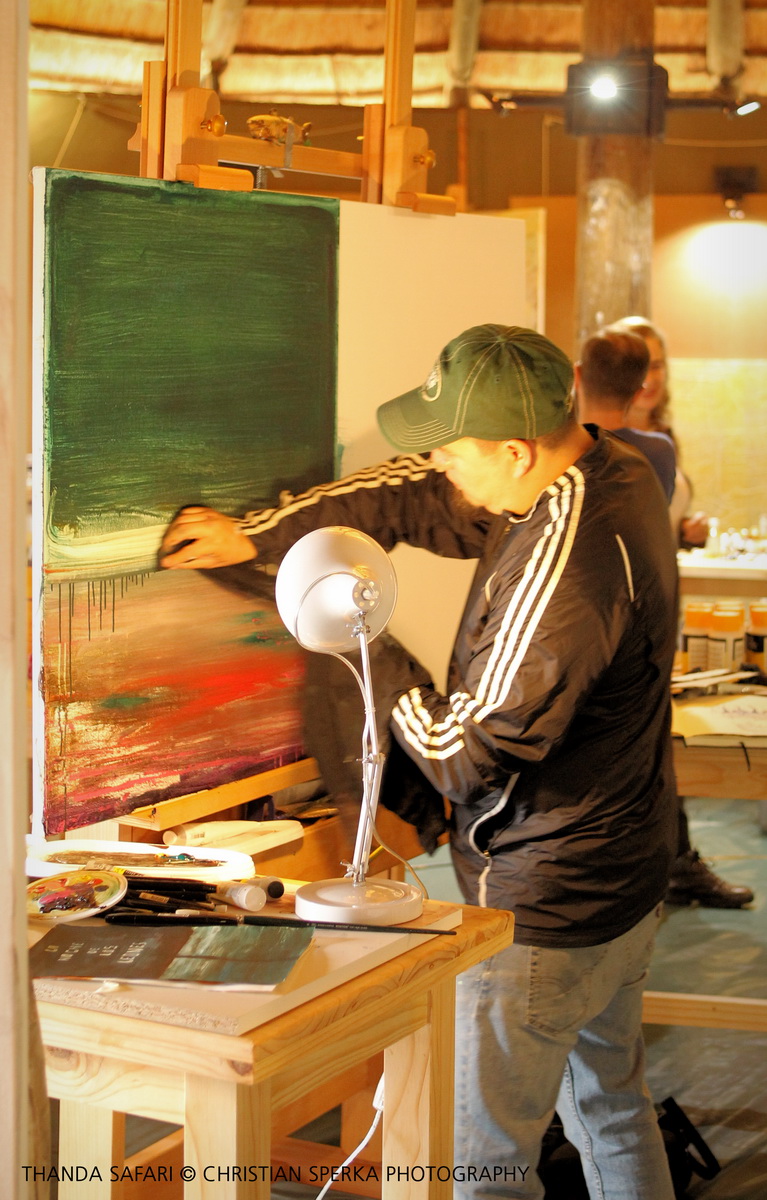 Agustin Gonzalez working on a painting