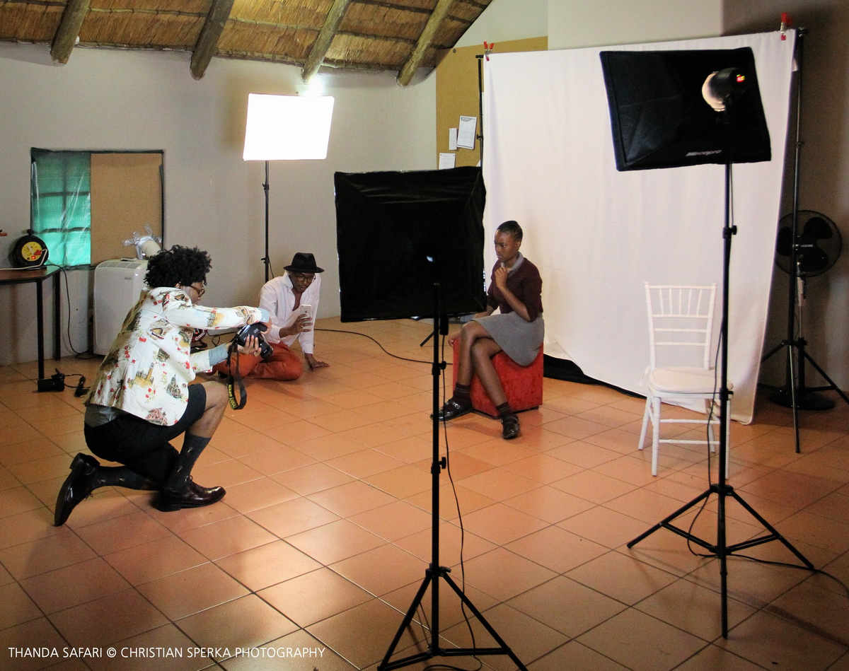 Ike Ude taking Star For Life school students images at the Intibane photo studio