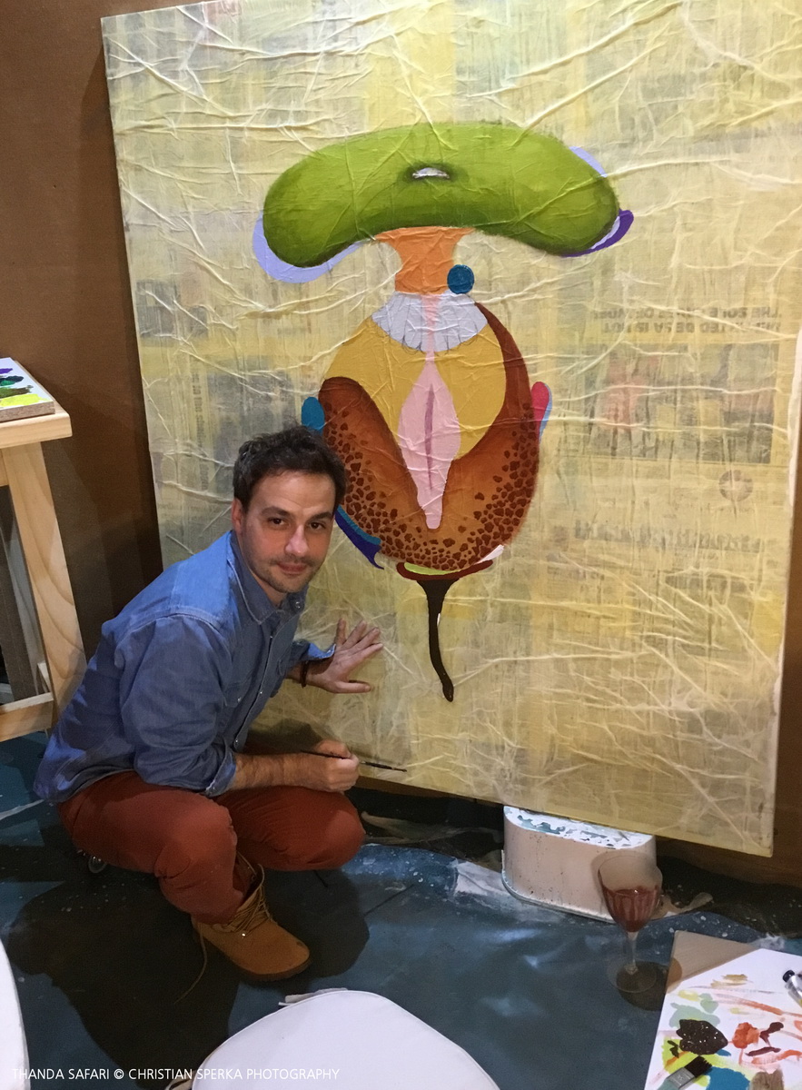 Leslie Sardinias working on his painting